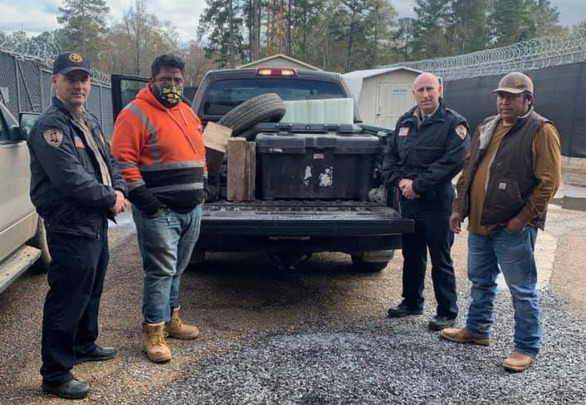 Deputies with Juan Antonio Rocha and a man he works with, Castro, retrieving a second haul of tools and equipment after Rocha's trailer had been returned.